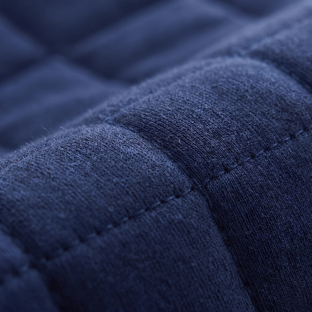 Close-up of the Wova Rest pillow quilted cover, navy blue